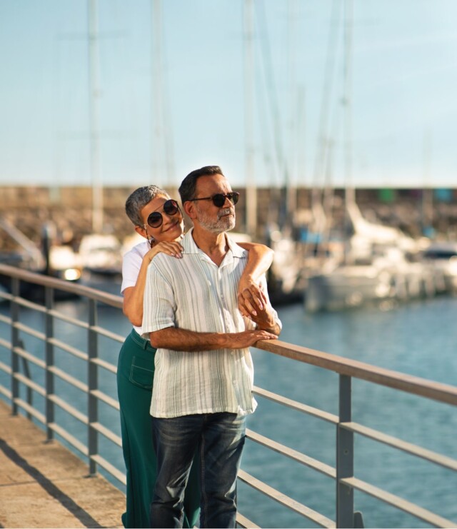 Couple standing in front of marina Marina content first-min